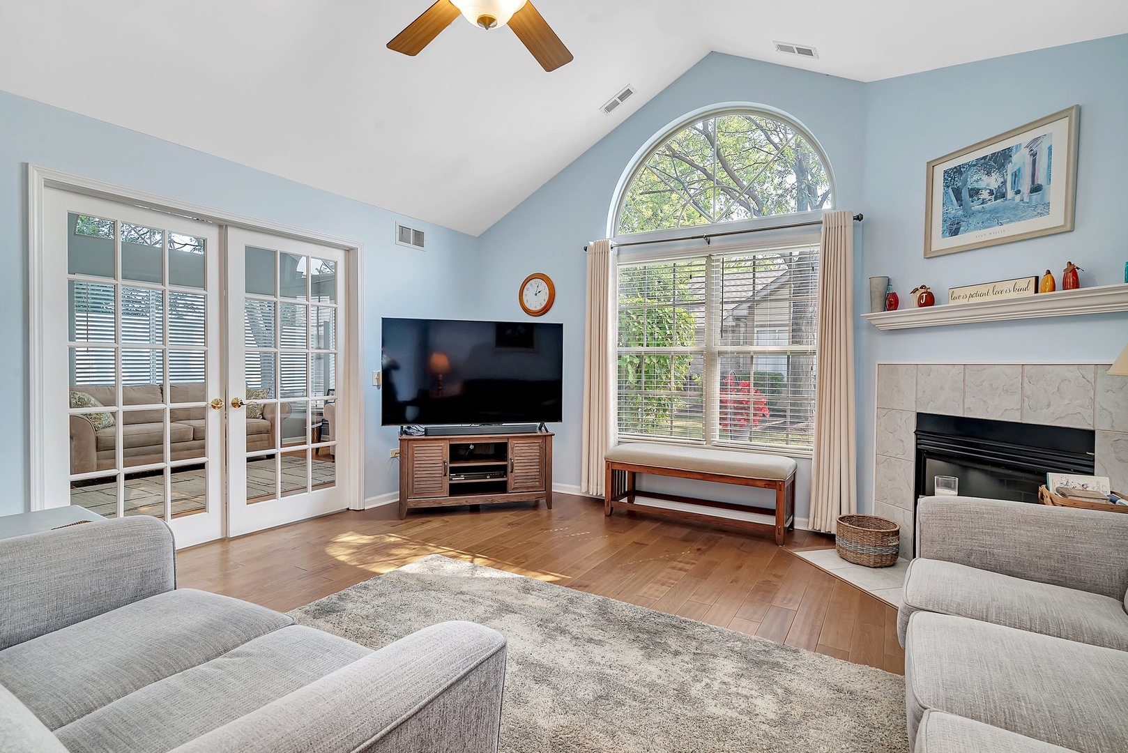 1950 Timbers Edge Circle Joliet, IL 60431 - Photo 6 of 24 a living room with furniture a flat screen tv and a large window
