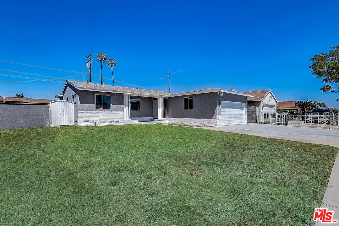 15815 South Haskins Avenue Compton, CA 90220 - Photo 11 of 29 a front view of a house with garden