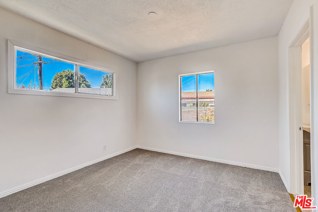 15815 South Haskins Avenue Compton, CA 90220 - Photo 7 of 29 an empty room with windows