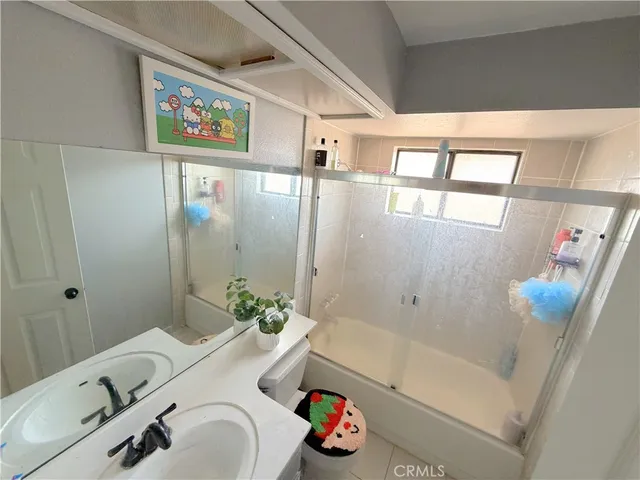 a bathroom with a sink and a shower