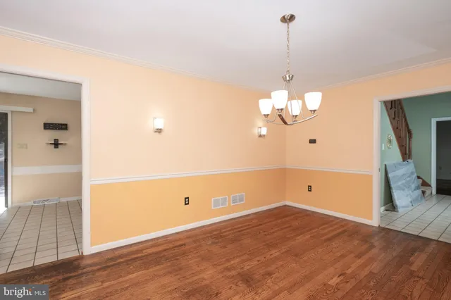 a living room with a flat screen tv and a fireplace