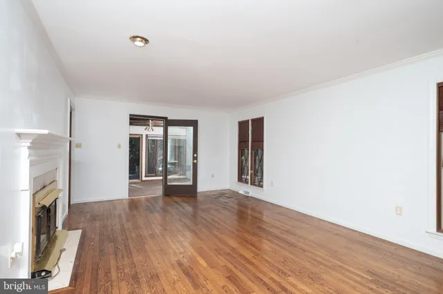 a kitchen with granite countertop stainless steel appliances a sink and a window