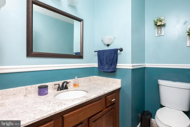 a view of a hallway with windows and stairs