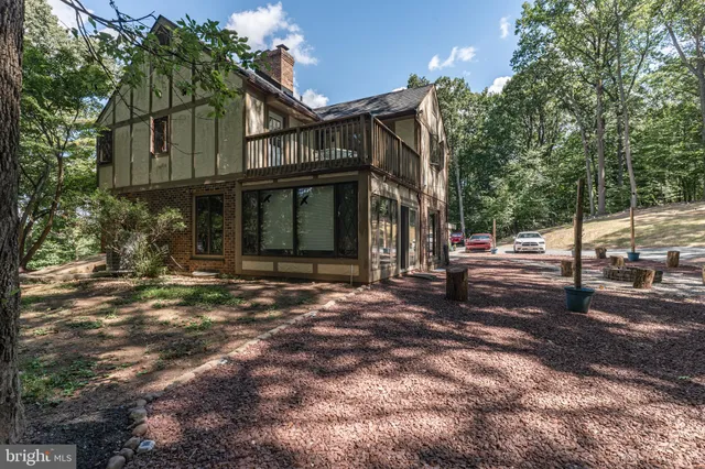 a view of house with outdoor space