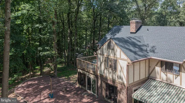 a view of a room with wooden floor and window