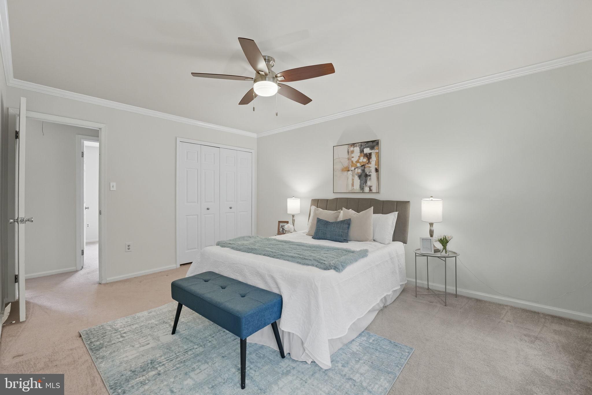 7954 Forest Path Way Springfield, VA 22153 - Photo 14 of 34 a bedroom with a bed and a table