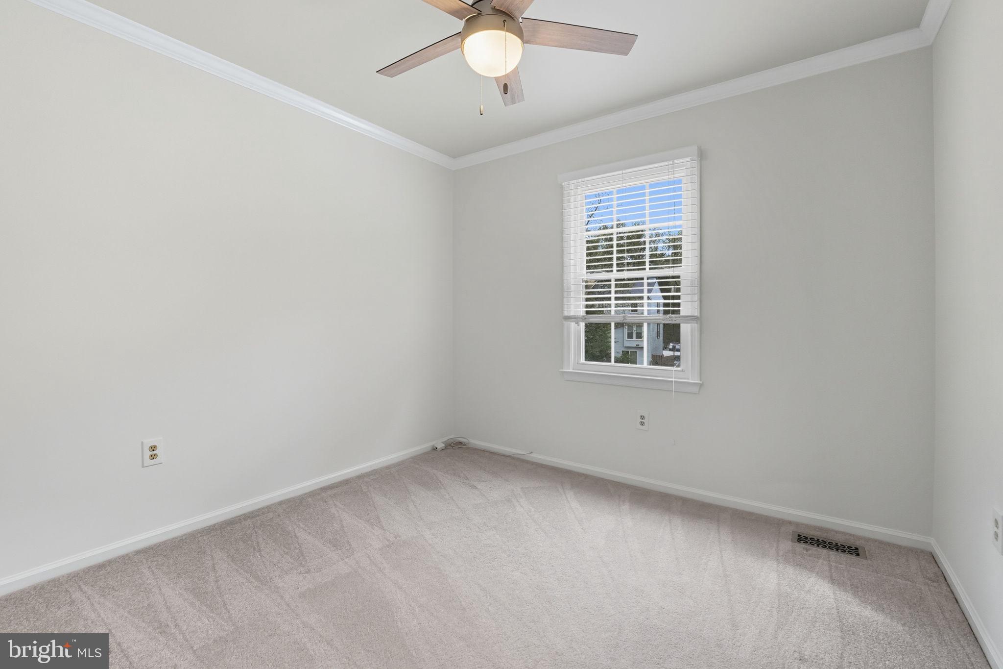 7954 Forest Path Way Springfield, VA 22153 - Photo 21 of 34 a view of an empty room with a window
