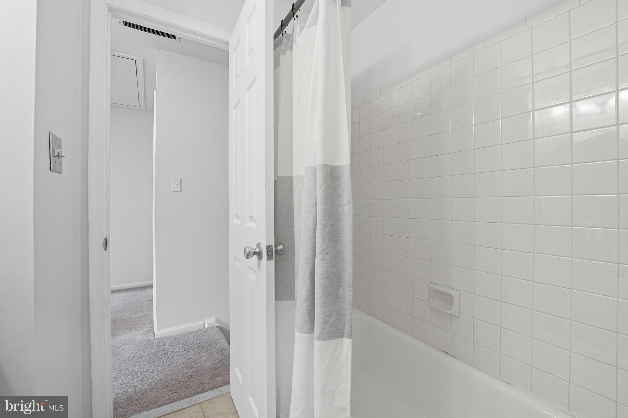 7954 Forest Path Way Springfield, VA 22153 - Photo 23 of 34 a bathroom with a shower