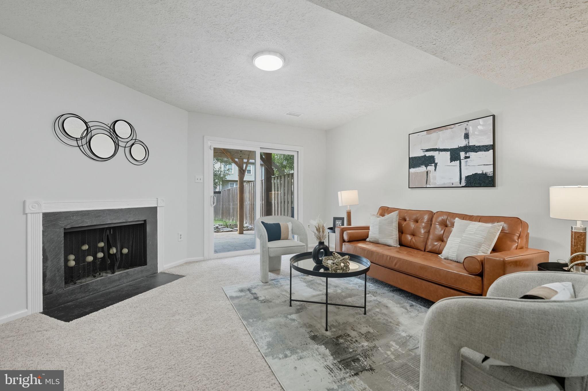 7954 Forest Path Way Springfield, VA 22153 - Photo 26 of 34 a living room with furniture and a fireplace