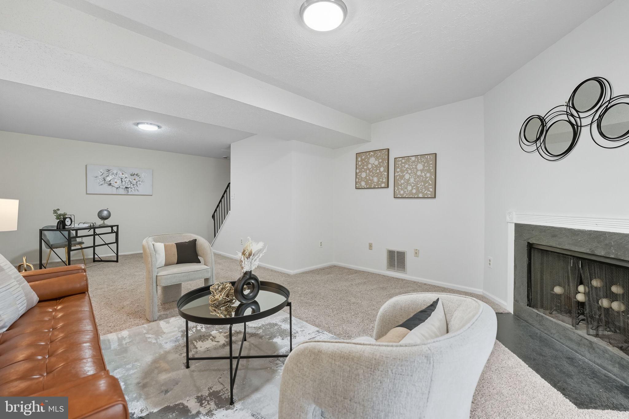 7954 Forest Path Way Springfield, VA 22153 - Photo 27 of 34 a living room with furniture and a fireplace