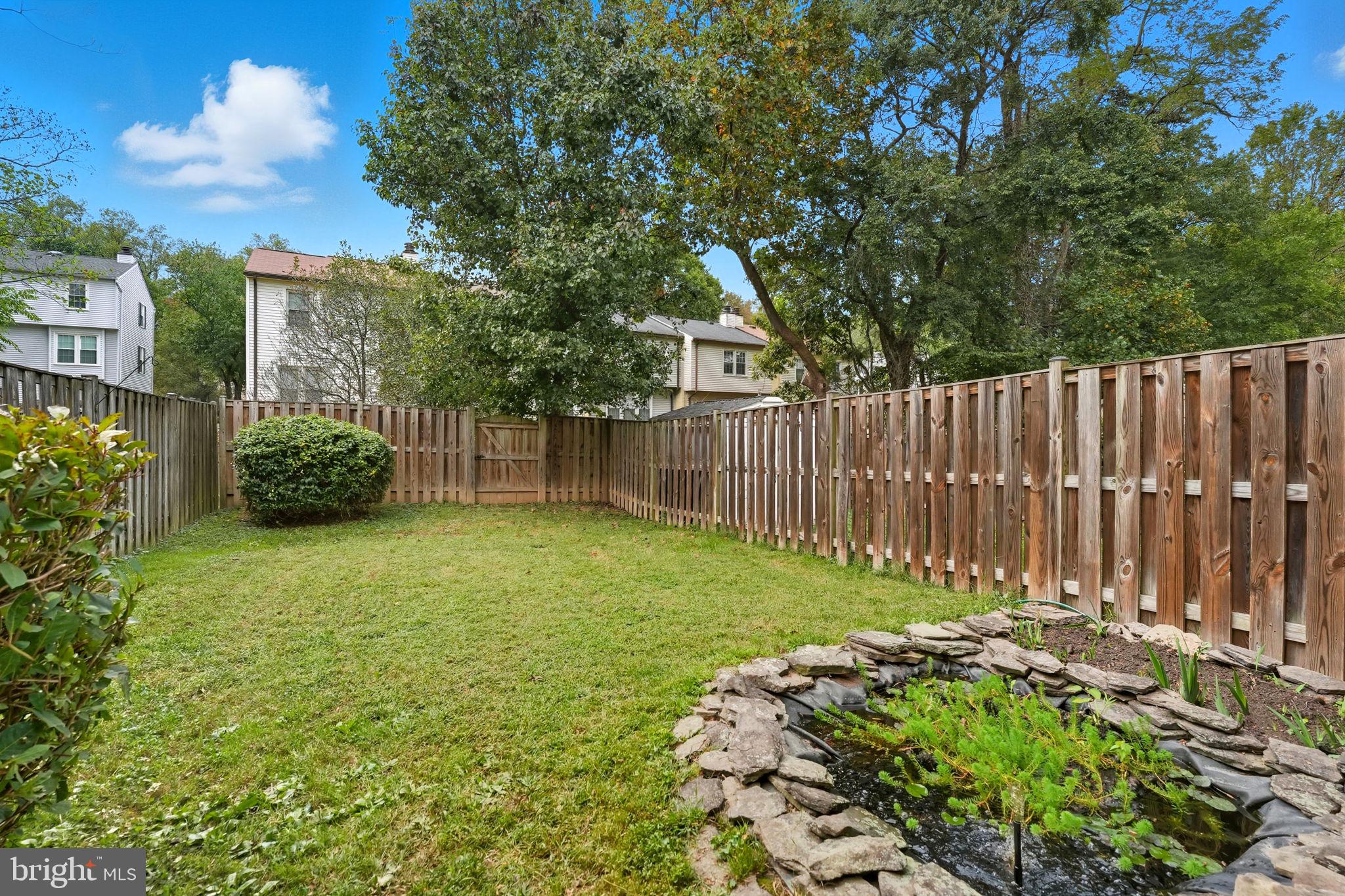 7954 Forest Path Way Springfield, VA 22153 - Photo 31 of 34 a garden view with wooden fence