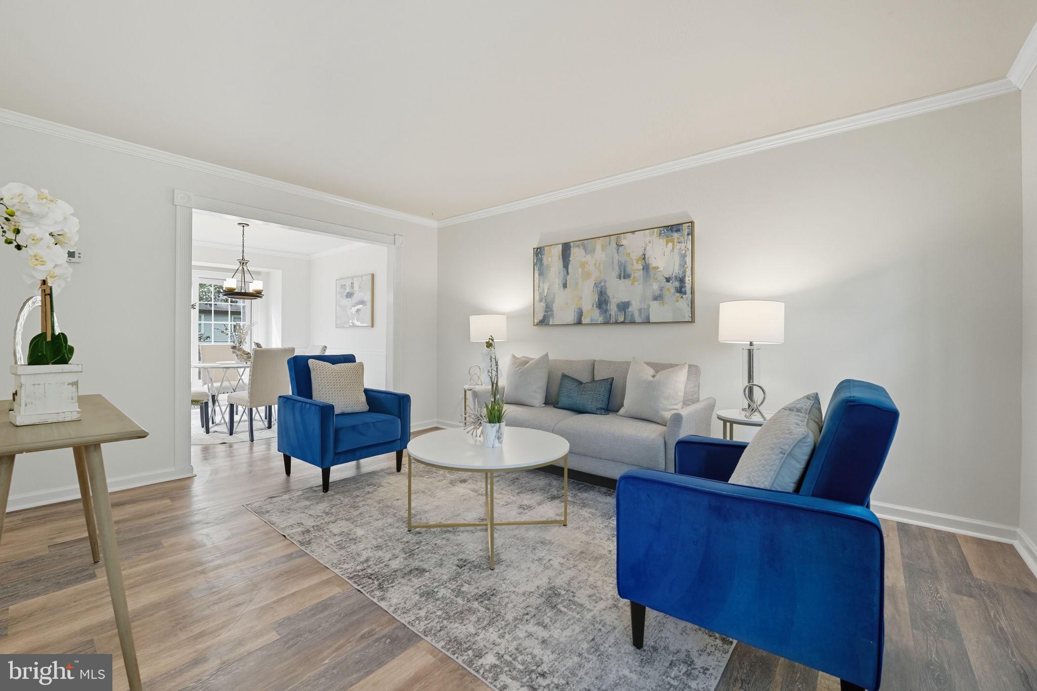 7954 Forest Path Way Springfield, VA 22153 - Photo 7 of 34 a living room with furniture and a wooden floor