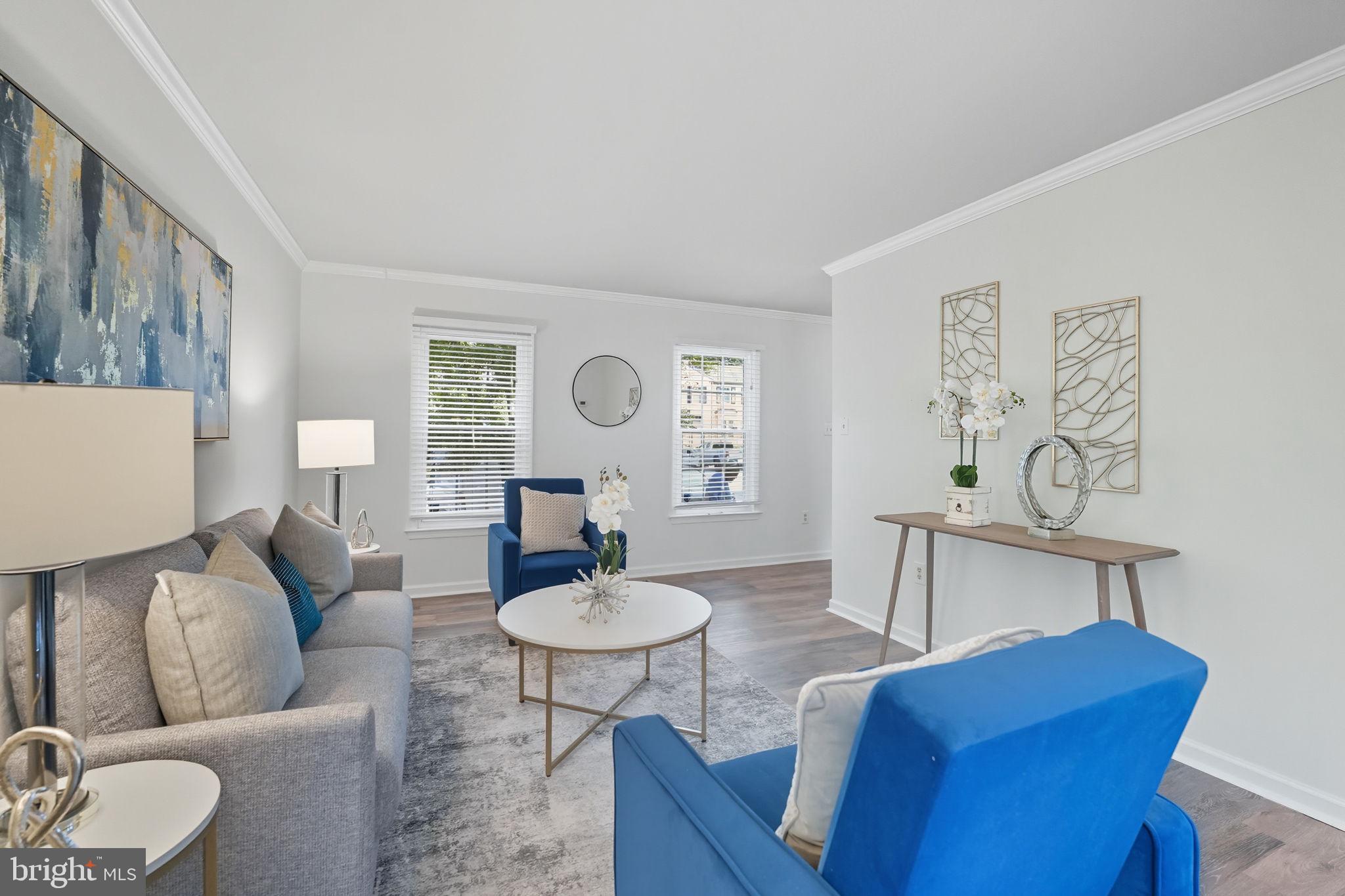 7954 Forest Path Way Springfield, VA 22153 - Photo 8 of 34 a living room with furniture and wooden floor