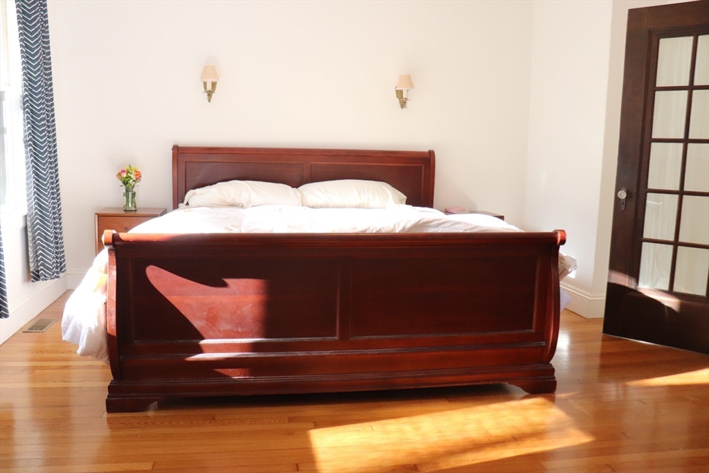 26 St Elmo Road Worcester, MA 01602 - Photo 11 of 42 a bedroom with a bed and a window