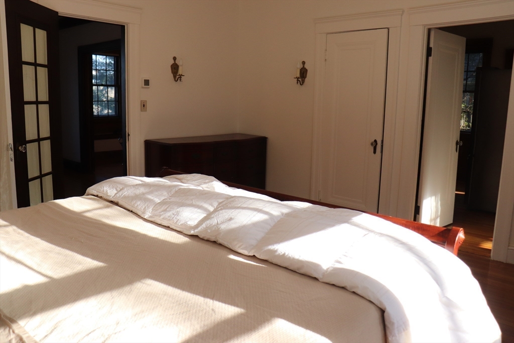 26 St Elmo Road Worcester, MA 01602 - Photo 13 of 42 a bedroom with a bed and a book shelf