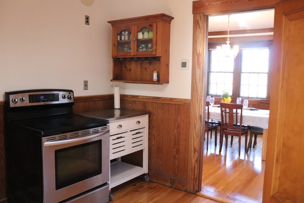 26 St Elmo Road Worcester, MA 01602 - Photo 17 of 42 a kitchen with a stove and a microwave