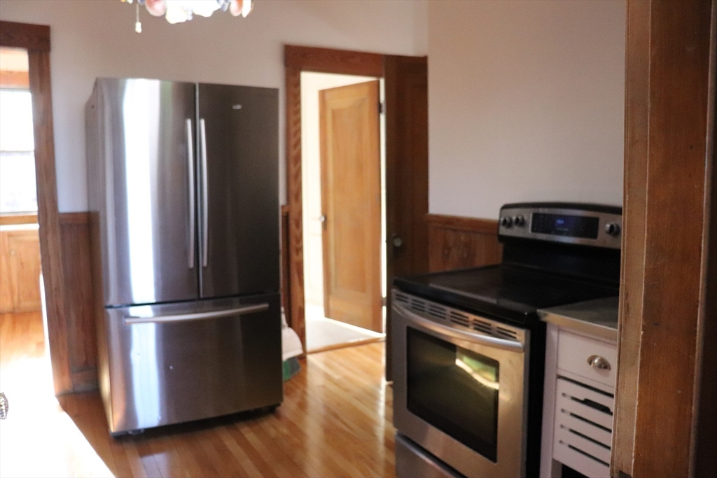 26 St Elmo Road Worcester, MA 01602 - Photo 18 of 42 a kitchen with a refrigerator stove and sink