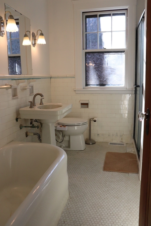 26 St Elmo Road Worcester, MA 01602 - Photo 22 of 42 a bathroom with a sink and a mirror