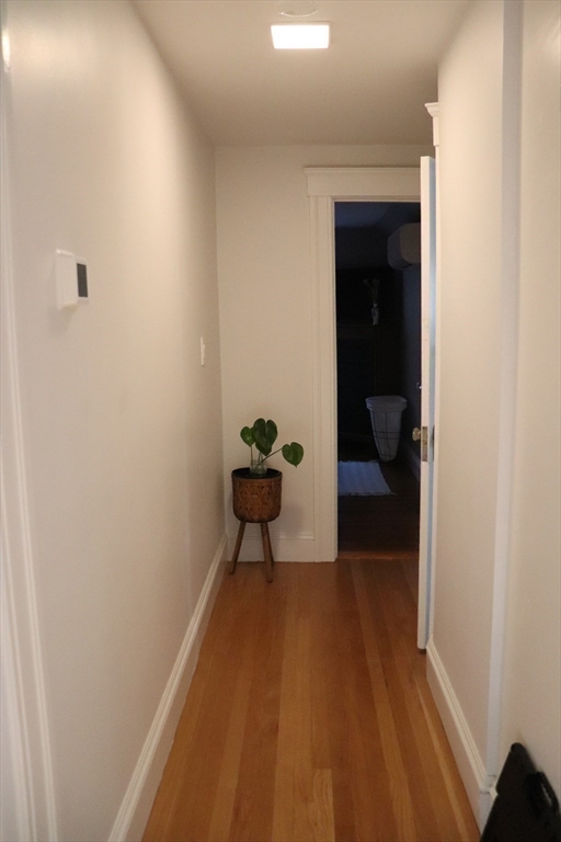 26 St Elmo Road Worcester, MA 01602 - Photo 33 of 42 a view of a hallway and a livingroom with furniture