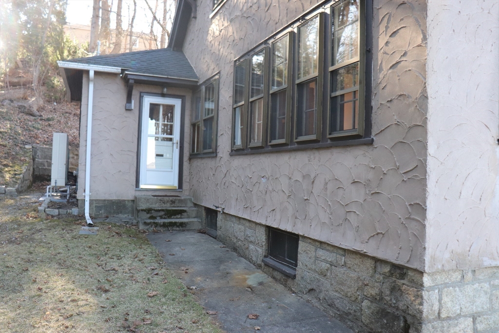 26 St Elmo Road Worcester, MA 01602 - Photo 36 of 42 a view of a house with a wooden door