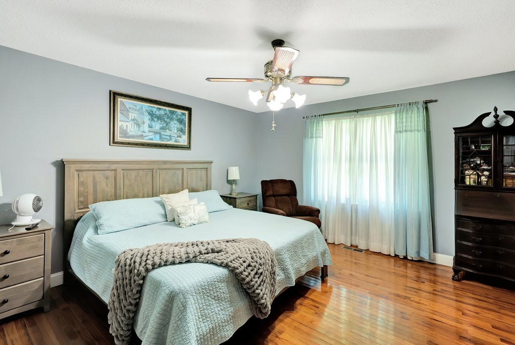 712 Kilgore Street Jasper, TN 37347 - Photo 20 of 43 a bedroom with a bed and a chandelier