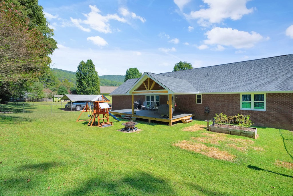 712 Kilgore Street Jasper, TN 37347 - Photo 6 of 58 a view of a house with backyard porch and sitting area