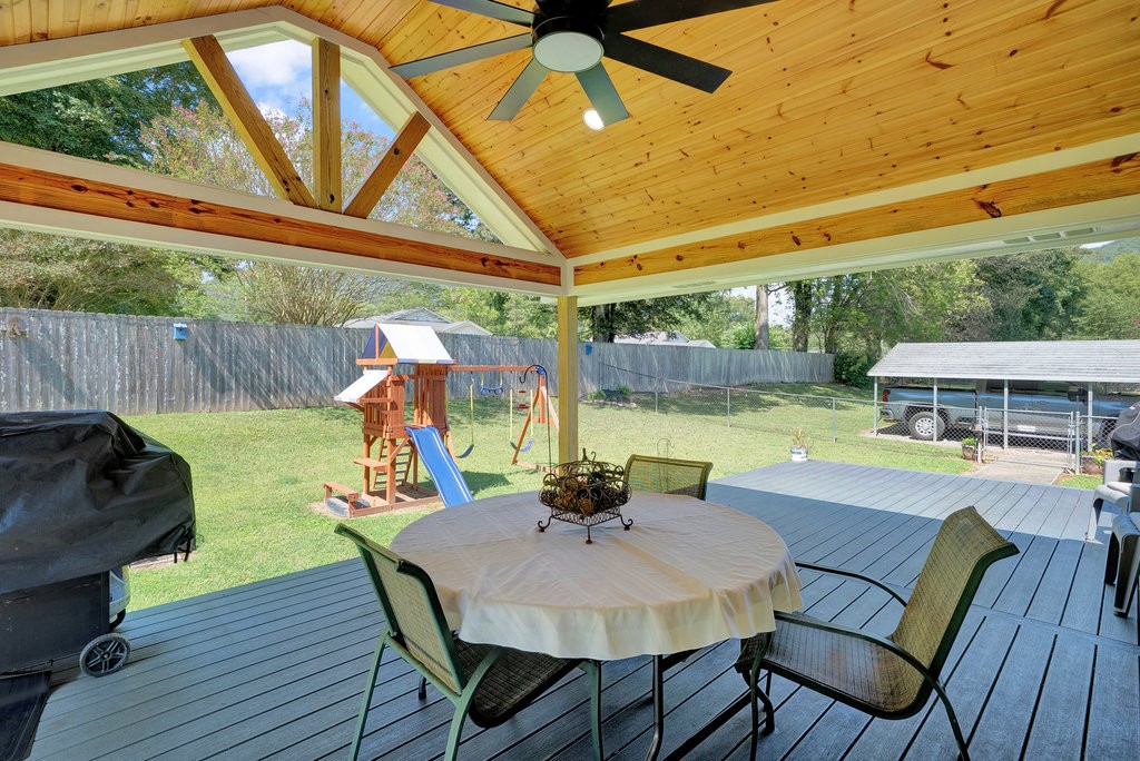 712 Kilgore Street Jasper, TN 37347 - Photo 8 of 43 a view of a patio with a table chairs and a table