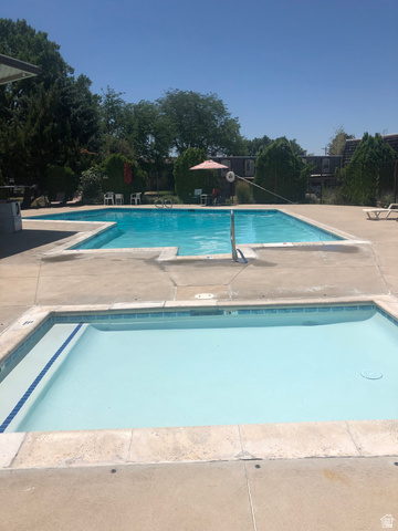88 West 50 South, Unit B5 Centerville, UT 84014 - Photo 32 of 33 Community pool and hot tub with a patio area