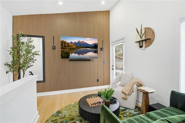 a bedroom with a bed and a painting on the wall