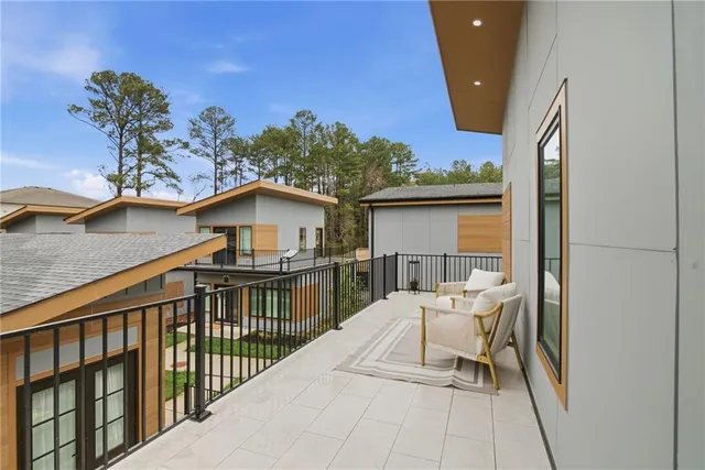 a balcony view with a outdoor seating space