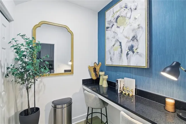 a room with furniture and potted plant