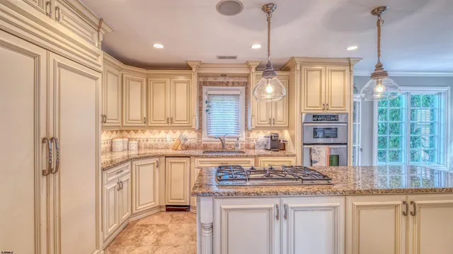 a view of a bedroom with wooden floor and windows