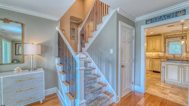 a living room with furniture and a baby crib