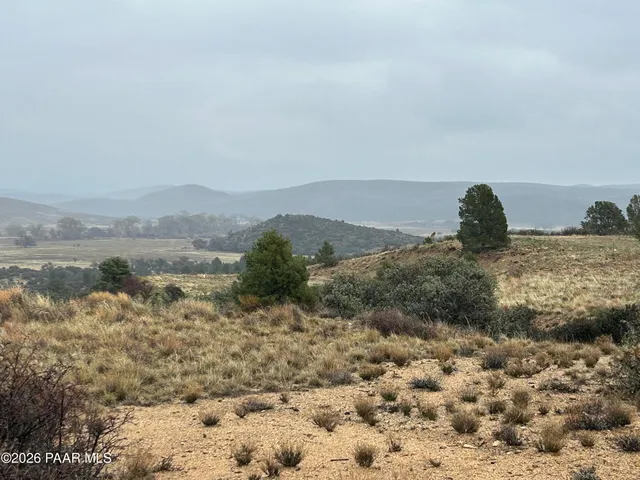 a view of a lake with mountains in the background