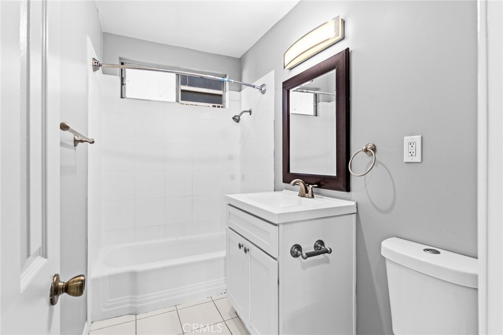 1106 Pacific Avenue Long Beach, CA 90813 - Photo 12 of 13 a bathroom with a sink a toilet and shower