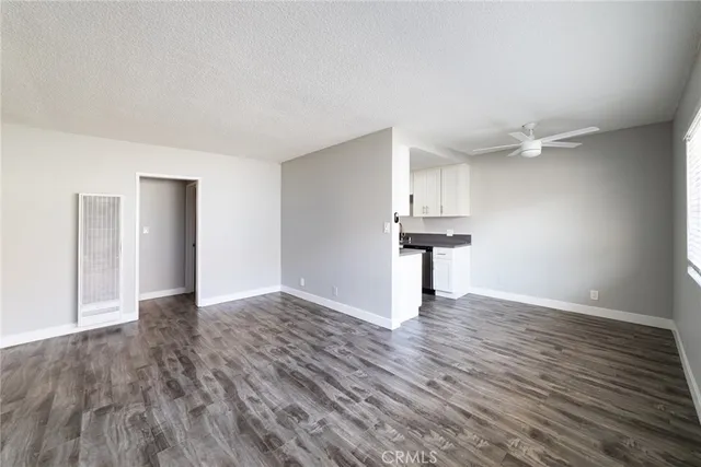 a kitchen with stainless steel appliances a sink dishwasher a stove and a microwave oven with cabinets