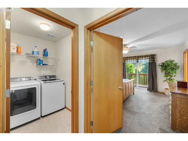 a view of hallway with washer and dryer