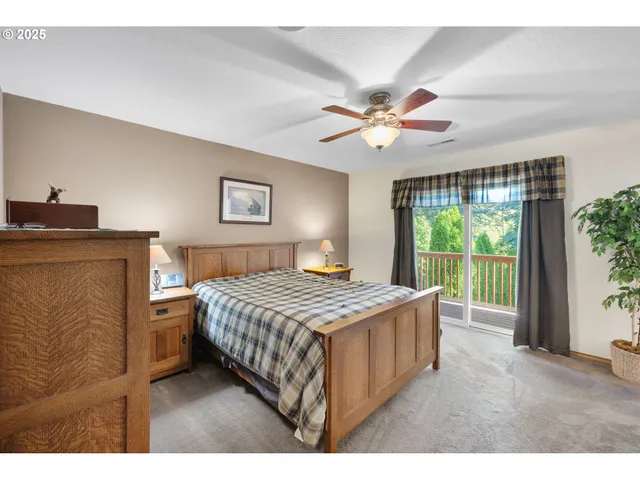 a bedroom with a bed dresser and a window