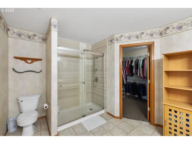 a bathroom with a shower and a toilet