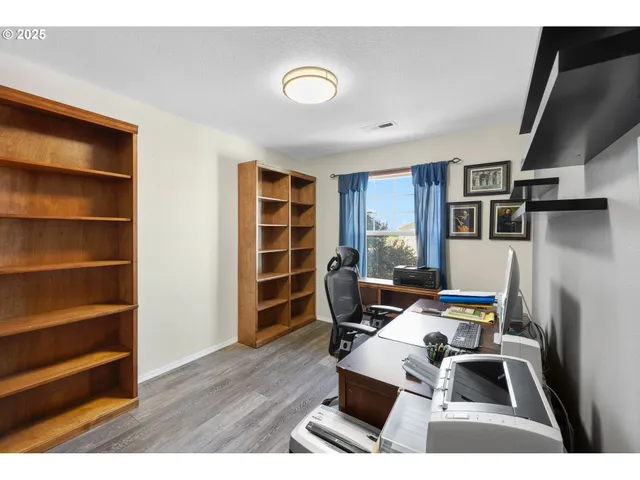 a living room with furniture a rug and a window