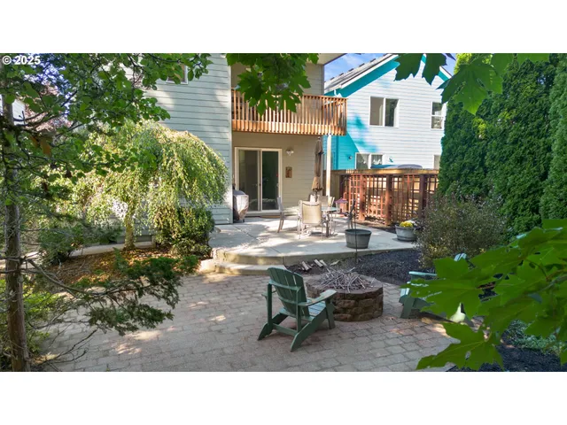 a backyard of a house with outdoor seating