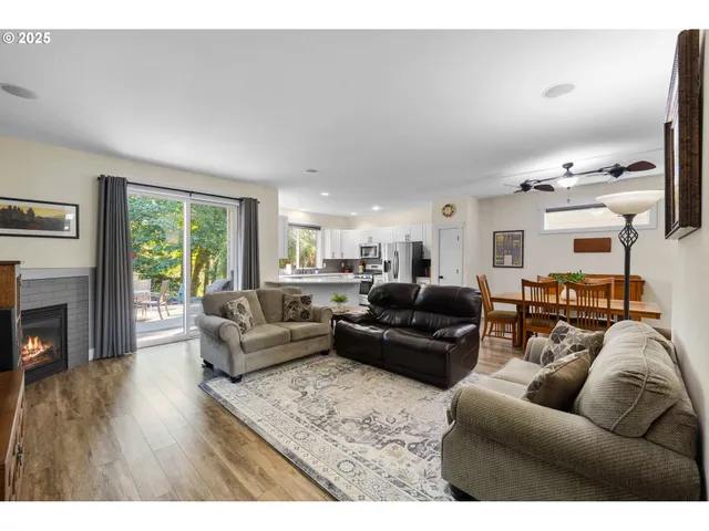 a living room with furniture fireplace and flat screen tv