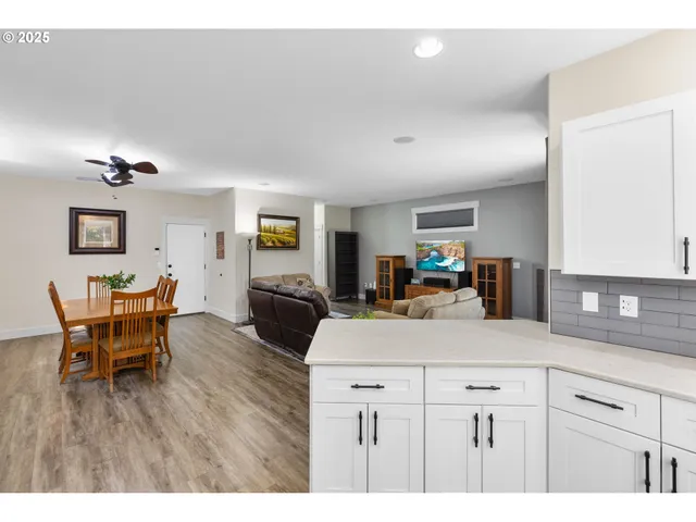 a kitchen with a table and chairs in it