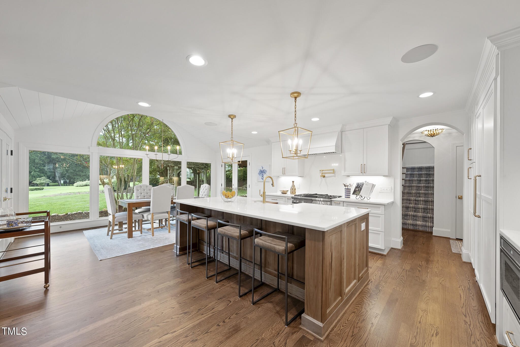 1704 Hunting Ridge Road Raleigh, NC 27615 - Photo 15 of 46 a large kitchen with kitchen island a large island in it