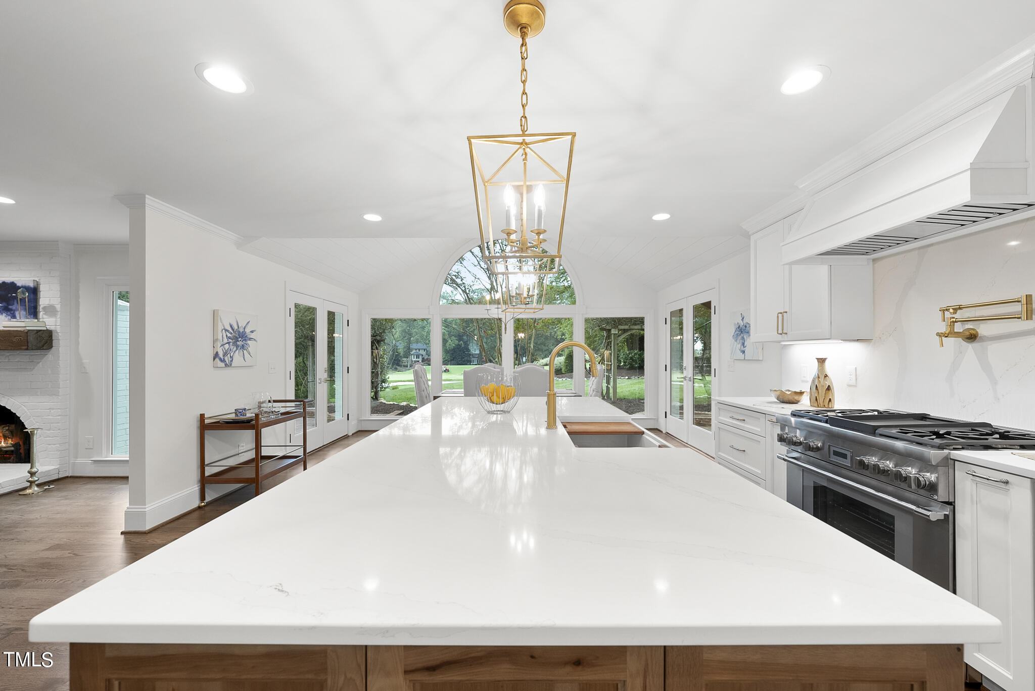 1704 Hunting Ridge Road Raleigh, NC 27615 - Photo 17 of 46 a large white kitchen with stainless steel appliances