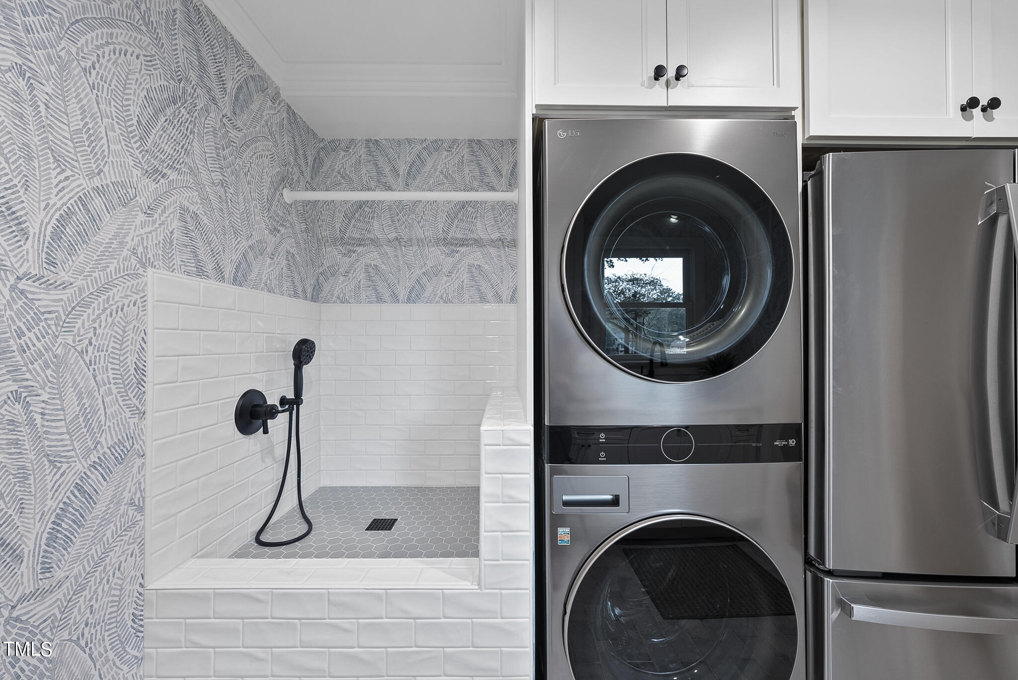 1704 Hunting Ridge Road Raleigh, NC 27615 - Photo 22 of 46 a bathroom with a washer and dryer