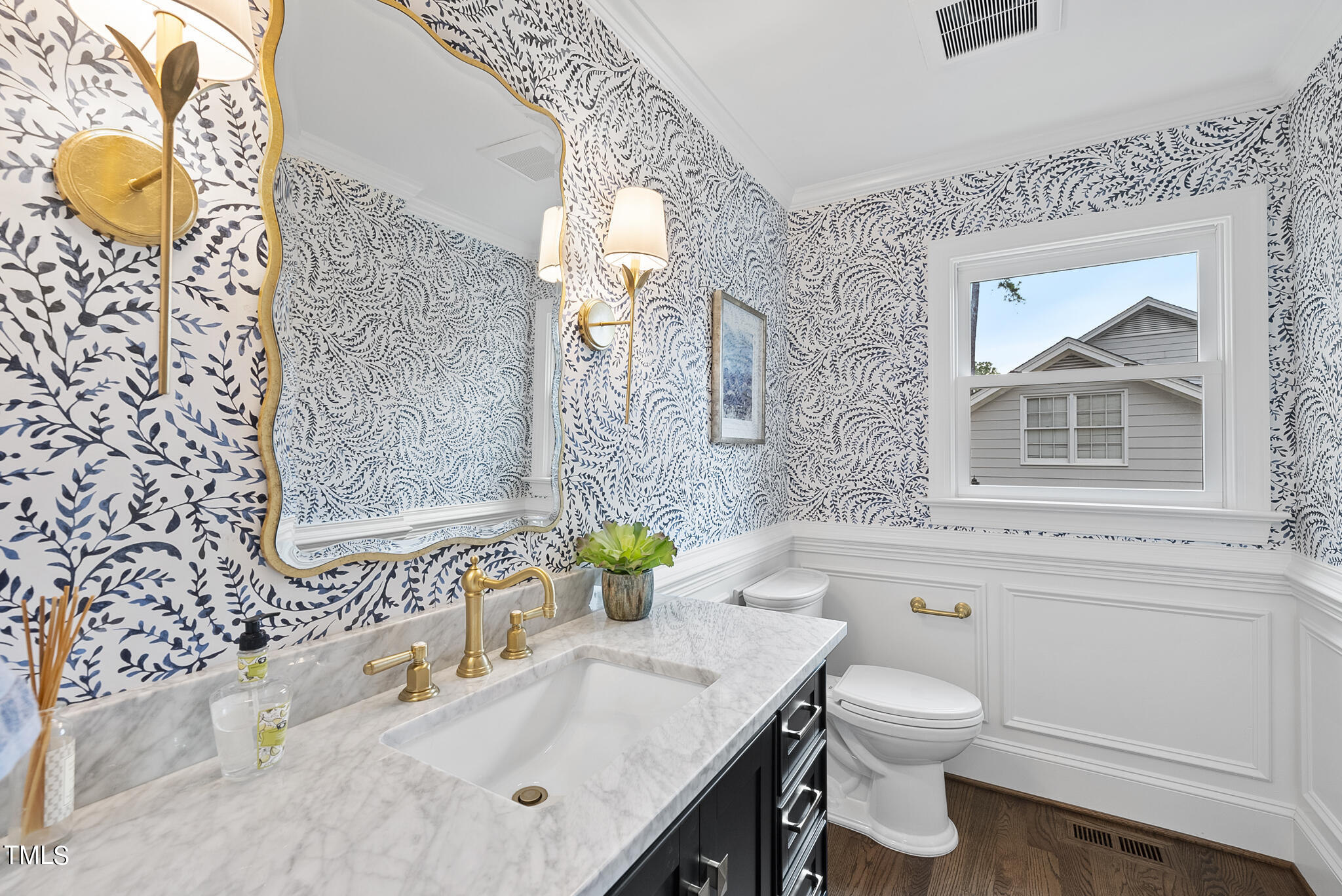 1704 Hunting Ridge Road Raleigh, NC 27615 - Photo 24 of 46 a bathroom with a granite countertop toilet sink and mirror