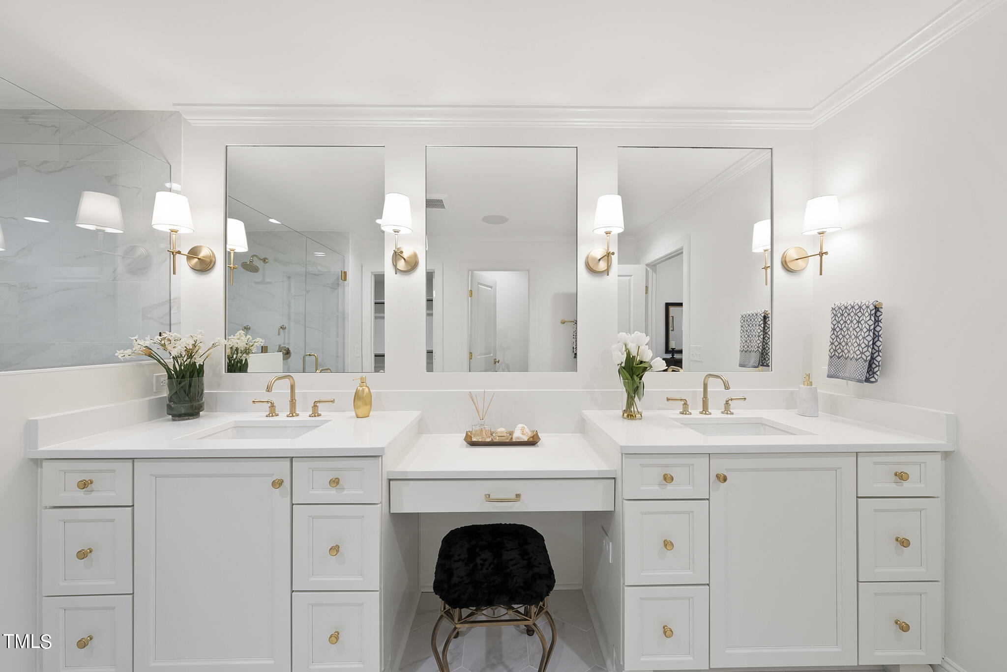 1704 Hunting Ridge Road Raleigh, NC 27615 - Photo 30 of 46 a bathroom with a sink vanity and a mirror