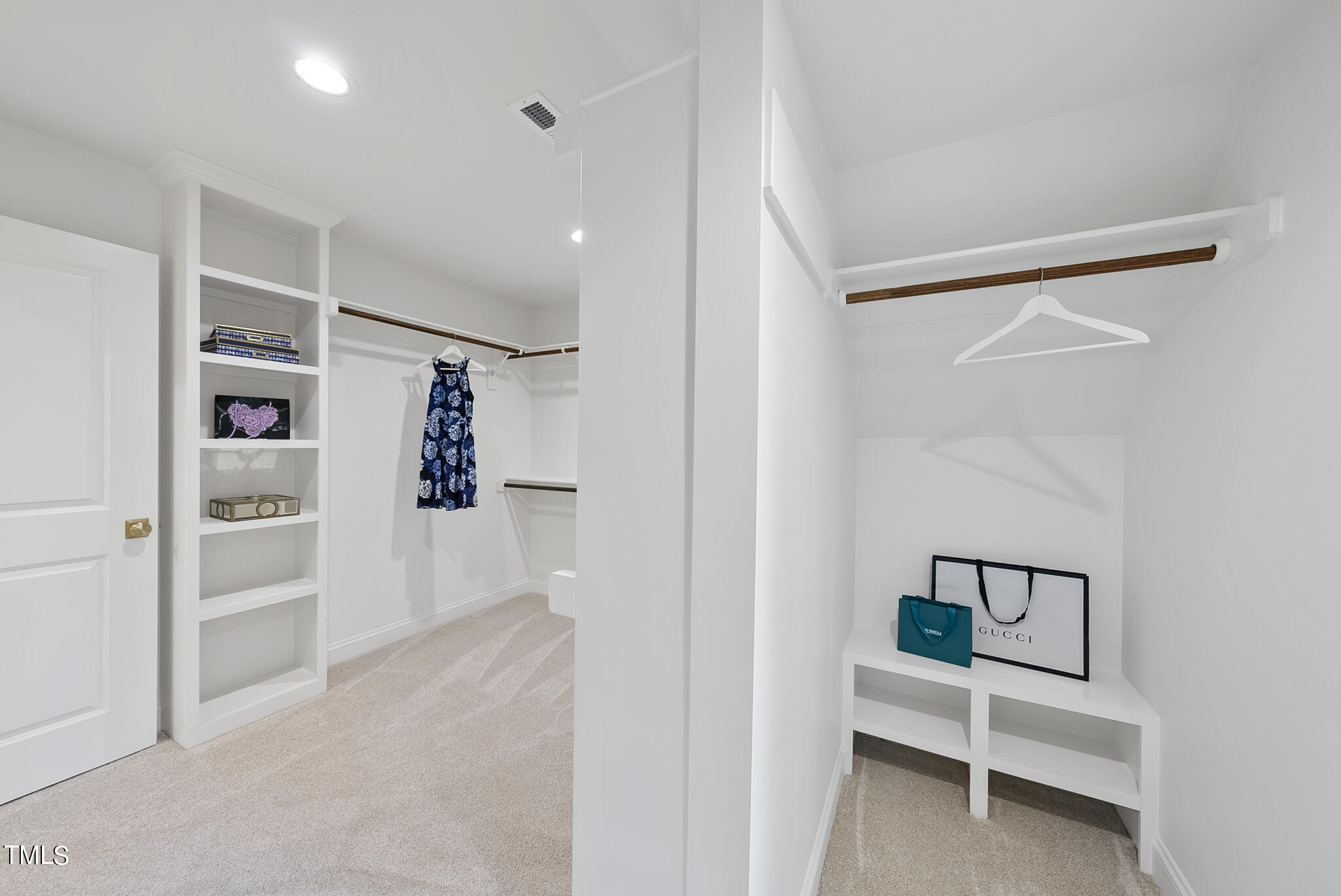 1704 Hunting Ridge Road Raleigh, NC 27615 - Photo 31 of 46 a view of a hallway with shelf