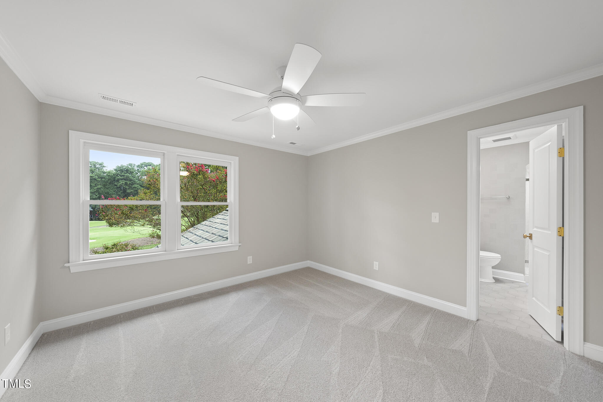 1704 Hunting Ridge Road Raleigh, NC 27615 - Photo 37 of 46 an empty room with a ceiling fan and a window